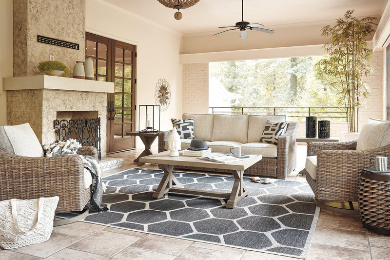 Ashley Furniture Beachcroft outdoor sofa with plush cushions, featuring a stylish design for outdoor lounging and relaxation.