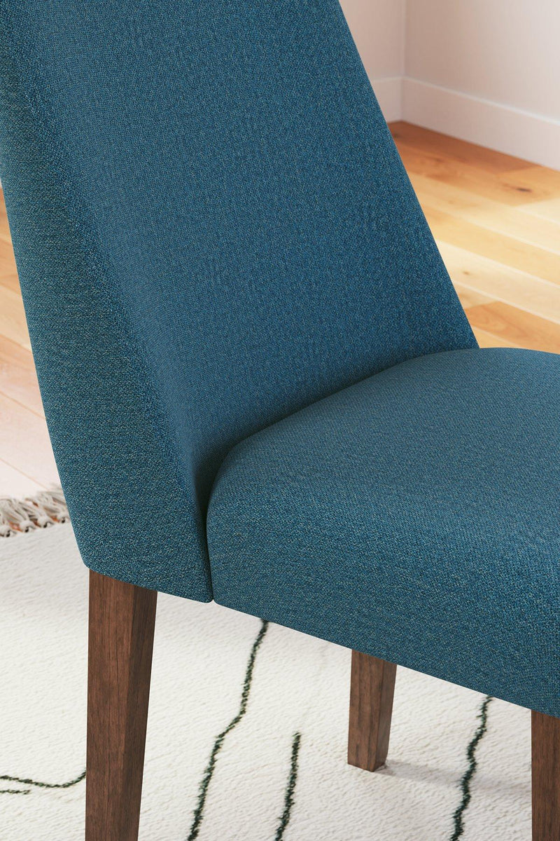 Ashley Furniture Lyncott Dining Room Set with a wooden table and six matching chairs in a modern dining space.
