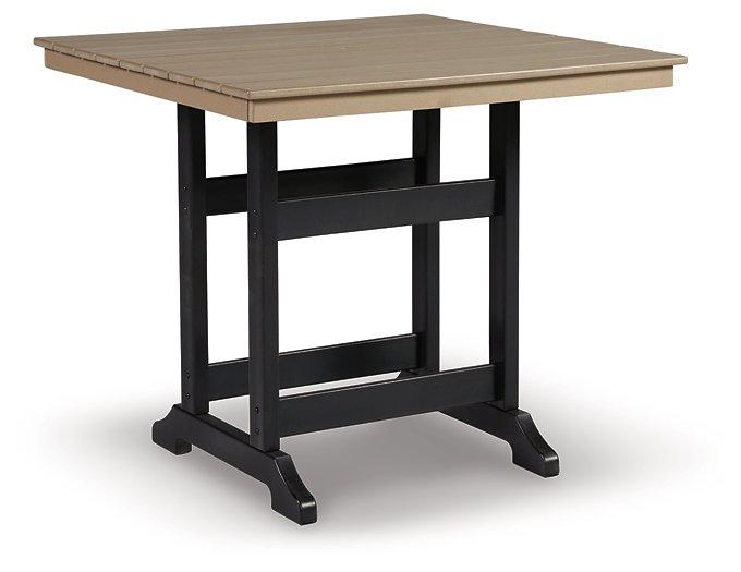 Outdoor dining set by Ashley Furniture featuring a sturdy table and matching chairs, perfect for patio or garden use.