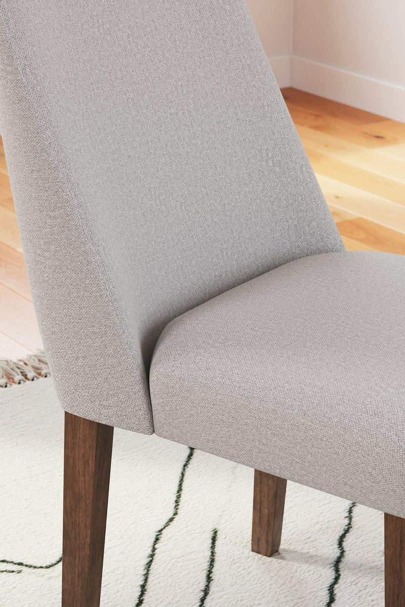 Ashley Furniture Lyncott dining room set with a wooden table and matching chairs in a modern dining space.