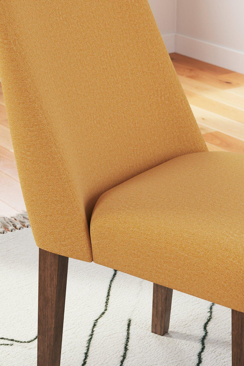 Ashley Furniture Lyncott dining room set with a wooden table and matching chairs in a modern dining space.