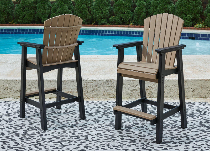 Outdoor dining set from Ashley Furniture featuring a table and chairs, perfect for garden or patio outdoor meals.