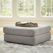 Ashley Furniture Avaliyah oversized accent ottoman with plush fabric and tufted top, perfect as a stylish living room addition.