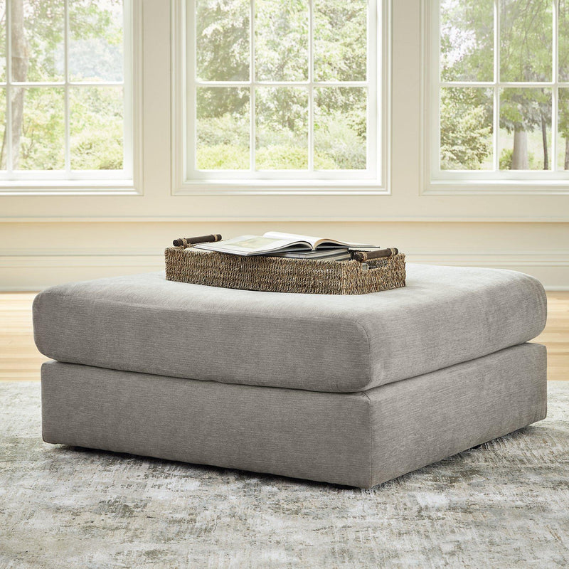Ashley Furniture Avaliyah oversized accent ottoman with plush fabric and tufted top, perfect as a stylish living room addition.