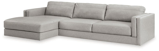 Ashley Furniture Amiata sectional with chaise, showing plush fabric upholstery and modern design in a spacious living room setting.