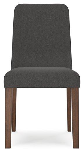 Ashley Furniture dining room set with a wooden table and upholstered chairs, showcasing a modern, elegant design.