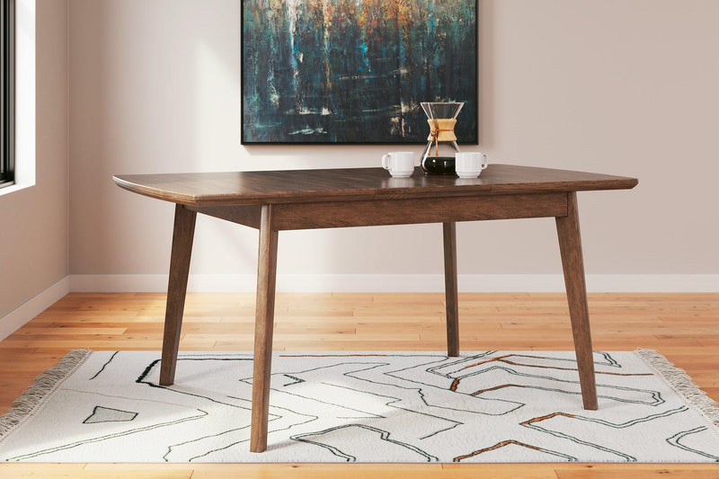 Ashley Furniture Lyncott dining room set with a rectangular table and six upholstered chairs in a modern design.