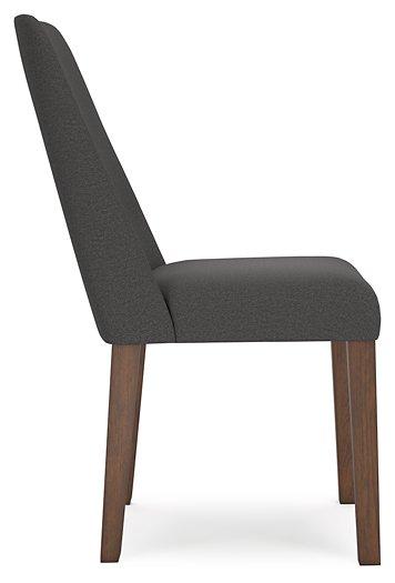 Ashley Furniture Lyncott dining room set with a wooden table and matching chairs in a modern dining space.