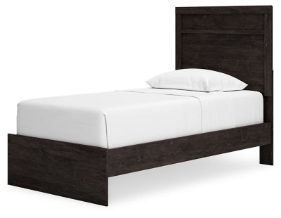 Ashley Furniture Belachime Bed with a wooden frame and elegant headboard, shown from an angled perspective.
