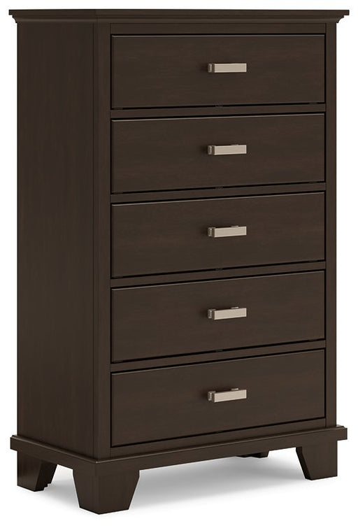 Ashley Furniture Covetown chest of drawers with six drawers and dark wood finish, shown from an angled view.