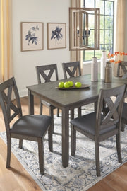Ashley Furniture Caitbrook dining table with six matching chairs, showcasing a classic wood design for family meals and gatherings.