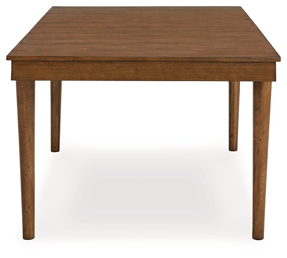 Ashley Furniture Lyncott Dining Room Set with a wooden table and matching chairs in a modern dining area.