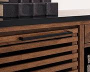 Close-up of the handle detail on the Kallari Credenza bookcase by Ashley Furniture, showcasing its stylish hardware and finish.