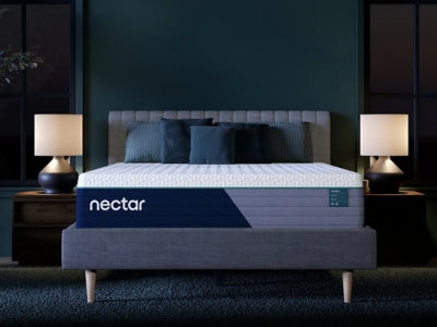 Nectar Premier Hybrid 5.1 mattress with quilted top and foam layers, shown in a side view highlighting its plush surface and construction.