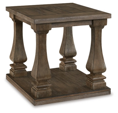 Ashley Furniture Johnelle end table with a modern design featuring a dark wood finish and angled legs.