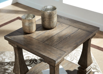 Ashley Furniture Johnelle End Table showing a wooden surface with a smooth finish and classic design.